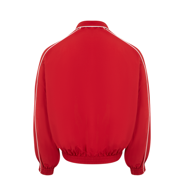 Image 2 of 2 - RED - WILLY CHAVARRIA Bad Boy Track Jacket featuring front zipper closure, side slant pockets with zipper closer, logo detail on left side of chest and elastic at waist. 100% nylon. Made in USA. 