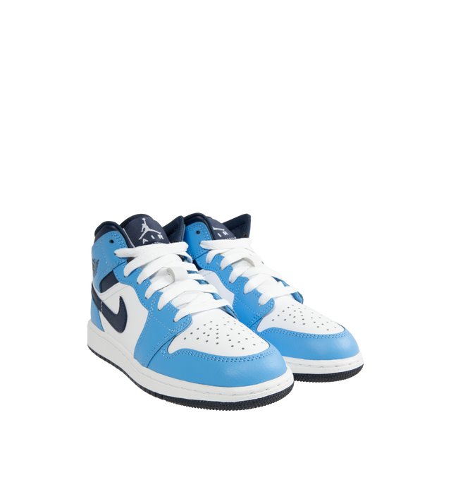 Image 2 of 5 - BLUE - Men's Air Jordan 1 Mid Sneakers feature a leather, synthetic leather, and textile upper with the iconic mid-top silhouette for a timeless heritage look. These lifestyle sneakers combine lightweight Nike Air cushioning, a foam midsole, and a durable rubber outsole with a pivot-circle traction pattern for lasting comfort, support, and reliable grip. Main Material: Leather, Synthetic Leather, and Textile. Midsole: Foam with Nike Air Cushioning. Sole: Rubber. 