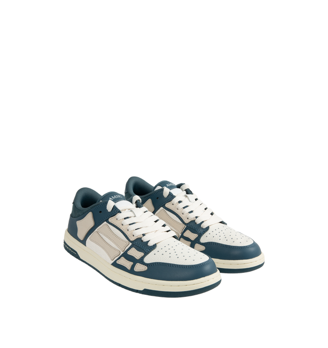 Image 2 of 5 - BLUE - Amiri Men's Quad Skel Top Low Sneakers are a lace-up style with perforation details, signature graphics, leather appliques, and two-tone rubber soles. Leather uppers. Made in Vietnam. 