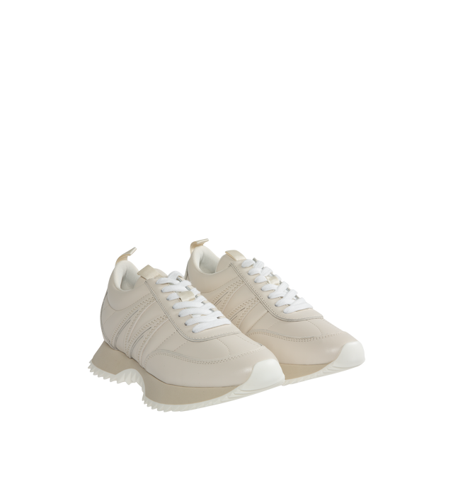 Image 2 of 5 - WHITE - MONCLER Pacey Bicolor Runner Sneakers featuring round toe, lace-up vamp, debossed tongue logo, logo emblem at backstay, M-logo stitch detail on the sides and rubber outsole. Leather. Made in Italy. 