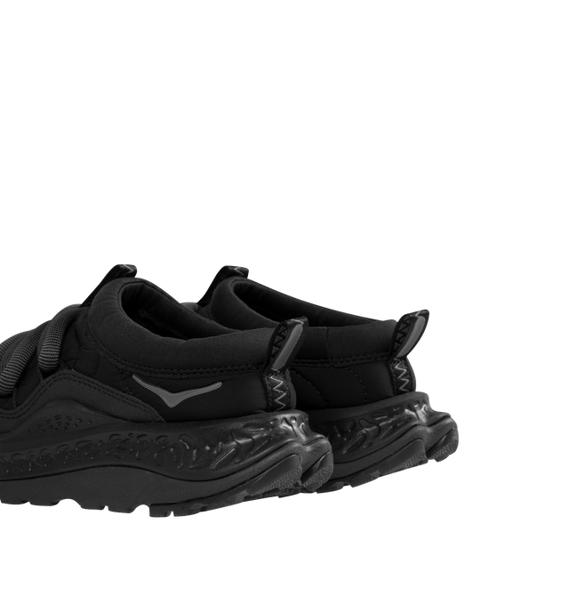 Image 3 of 5 - BLACK - HOKA Ora Primo Sneaker featuring soft knit collar, insulated puff upper, slip-on style, zig-zag stitch detail, round elastic lace system and protective toe bumper. Nylon, textile. Rubber sole. 