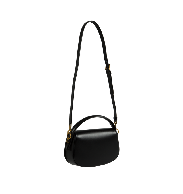 Image 2 of 3 - BLACK - Saint Laurent half-moon shoulder bag in calfskin with a gently polished finish. Features a flap with pivoting Cassandre closure, one flat pocket inside and an adjustable and detachable swivel-hook strap for bespoke carry options.  Calfskin with leather lining, bronze-tone hardware. Measures 9.4" X 5.9" X 2" with a 2.4" handle drop and 10.6" strap drop. Made in Italy. 