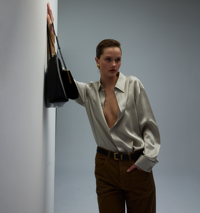 Image 4 of 4 - WHITE - SAINT LAURENT Boyfriend Shirt featuring concealed front button closure, pointed collar, one button french cuffs and curved stepped hem. 100% silk. Made in Italy.  