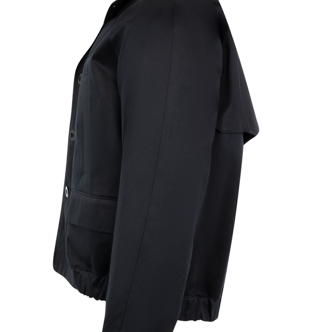 Image 3 of 3 - NAVY - Sacai Chino Jacket has a classic collar, front flap pockets, a front zip and button closure, and diagonal chest pockets. 100% cotton.  