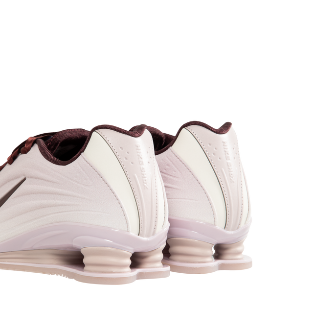 Image 3 of 5 - RED - NIKE Shox Z SE Sneaker featuring a slim, low-profile shape, textile upper, synthetic leather accents, Nike Shox columns, modified, circular Waffle outsole, foam midsole and rubber outsole. 