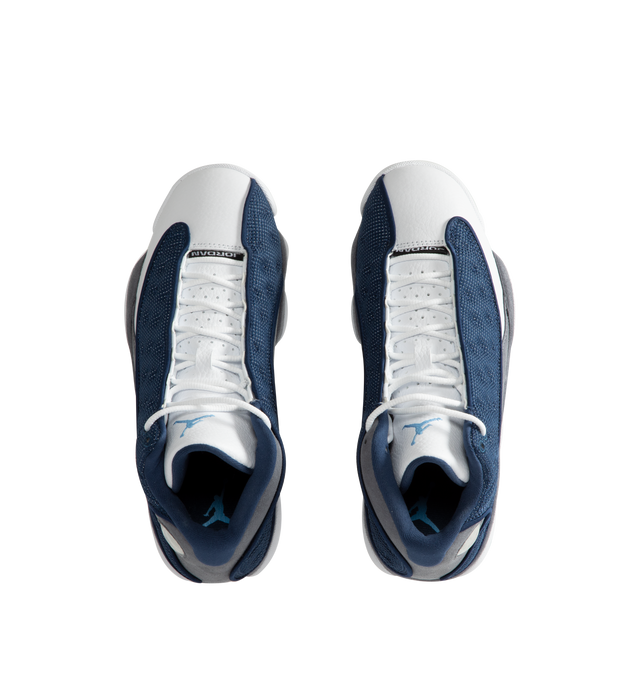 Image 5 of 5 - BLUE - Men's Jordan 13 "Flint 2020" Sneakers feature a premium leather upper with Flint Grey nubuck overlays, French Blue reflective ballistic mesh panels, and the signature holographic emblem for an iconic heritage design. These lifestyle sneakers combine responsive cushioning, a supportive midsole, and a durable rubber outsole for lasting comfort, stability, and everyday traction. Main Material: Leather, Nubuck, and Textile. Midsole: Cushioned Foam. Sole: Rubber.  