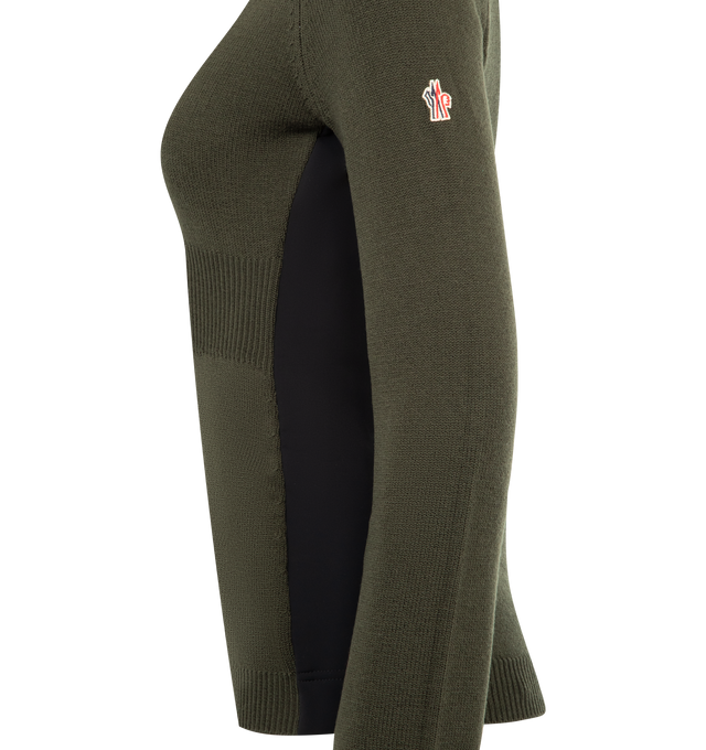 Image 3 of 3 - GREEN - MONCLER GRENOBLE Wool Turtleneck Sweater featuring stretch Merino wool, performance light fleece sides and underarms, turtle neck, stockinette stitch, gauge 7 and embroidered logo. 95% virgin wool, 5% polyester. 55% polyester, 34% polyamide/nylon, 11% elastane/spandex. Made in Moldova. 