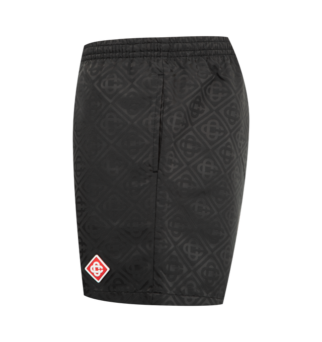 Image 3 of 3 - BLACK - CASABLANCA Jacquard Swim Shorts featuring an all-over print, signature monogram fabric, elasticated waistband with an internal drawstring fastening, in-seam pockets, and a lining. Technical swim jacquard fabric. 100% polyester. Lining: 80% polyamide 20% elastane. Made in Portugal. 
