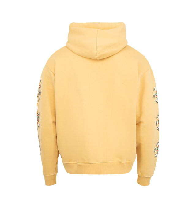Image 2 of 3 - YELLOW - BARRIERS Cowrie Shell Hoodie featuring 500 GSM french terry, hidden pocket, garment dyed, front graphic with cracked distress print and cowrie sleeves in puff print for 3D effect. 100% cotton.  