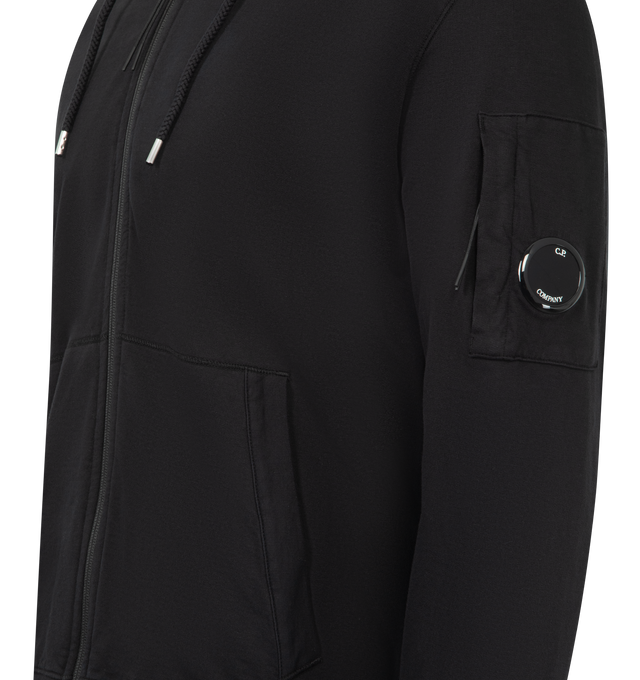 Image 3 of 3 - BLACK - C.P. COMPANY Light Fleece Zip Hooded Lens Sweatshirt featuring adjustable drawstring hood, full zip fastening, lens detail, kangaroo pocket, ribbed cuffs and hem, garment dyed and regular fit. 100% cotton. Made in Italy. 