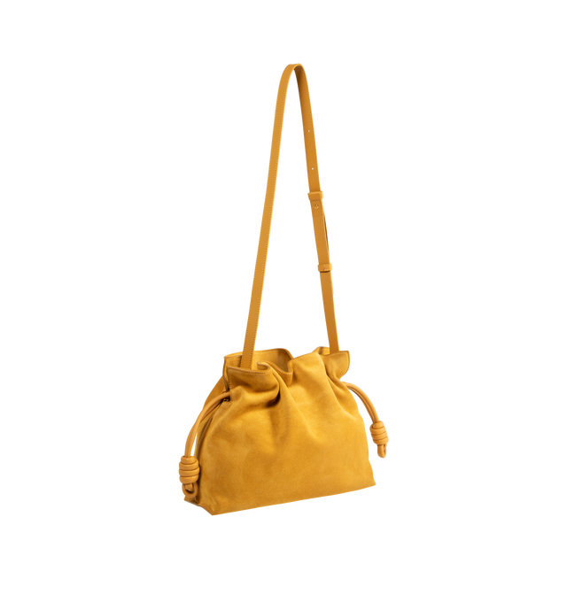 Image 2 of 3 - YELLOW - Loewe Women's Flamenco Medium Clutch is crafted from suede and features the collections signature slouchy silhouette, a cinched closure with iconic knotted drawstrings, and a detachable adjustable strap. Designed to be carried on the shoulder, crossbody, or by hand, this versatile style is finished with a magnetic closure, suede lining, and gold embossed LOEWE branding. Main Material: Suede. Lining: Suede. Dimensions: 30 x 24.5 x 10.5 cm / 11.8 x 9.6 x 4.1 in. Strap Length: 96-120 cm 