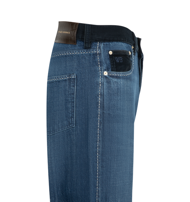 Image 3 of 3 - BLUE - Wales Bonner Men's Studio Jeans are crafted from pure cotton denim and  contrasting corduroy waistband, contrast stitching, and subtle distressed detailing for a lived-in finish. Embroidered branding at the coin pocket and a leather logo patch at the back complete the heritage-inspired design. Main Material: 100% Cotton.  