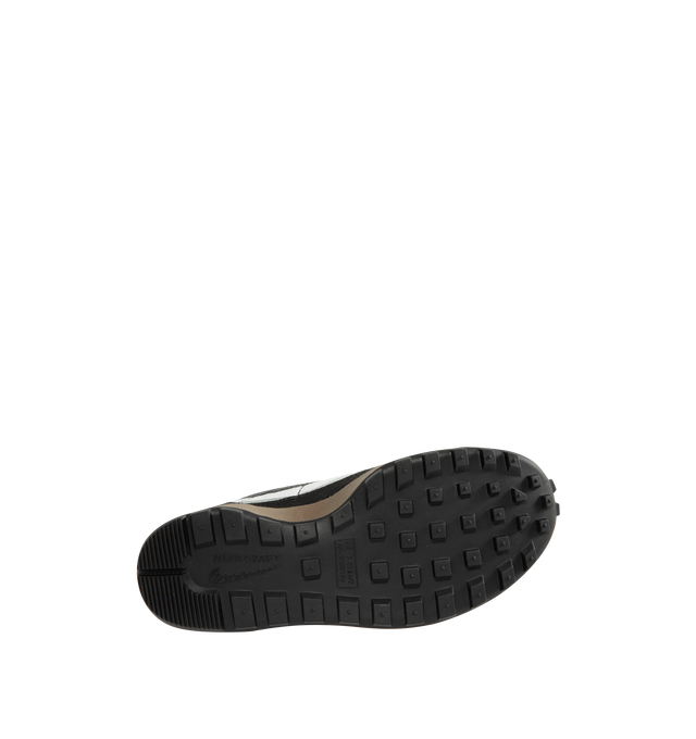 Image 4 of 5 - BLACK - Tom Sachs x Nike Unisex NikeCraft General Purpose Shoe "Demerits" is crafted from durable leather and features a low-profile silhouette inspired by everyday utility and wearability. Designed with blue nylon herringbone pull straps, a premium microfiber collar, and an embroidered "NIKE" logo in Tom Sachs' handwriting at the heel, this edition references the designer's "Demerits" concept. Main Material: Leather Upper. Collar: Premium Microfiber. Midsole: Gum Rubber with EVA Foam C 