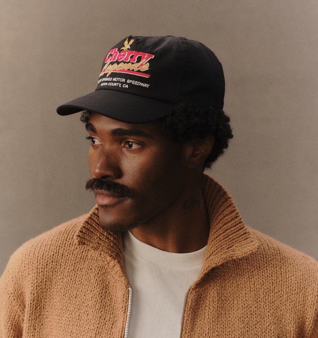Image 6 of 7 - BLACK - Cherry LA Men's Legends 5 Panel Hat is crafted from nylon and features a classic five-panel silhouette with embroidered detailing at the front. Designed with a branded flag tab at the back and an adjustable plastic snap closure, this everyday accessory combines lightweight construction with signature Cherry LA styling. Main Material: Nylon. Fit: Adjustable. Closure: Plastic Snapback Closure. Details: Front Embroidery, Branded Flag Tab. Made in Los Angeles, California. 