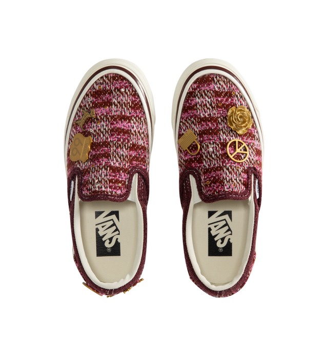 Image 5 of 5 - RED - Vans Unisex Premium LX Classic Slip-On 98 Cardigan Sneakers are crafted from multicolor knit cardigan textile and feature the brand's iconic laceless slip-on silhouette, decorative gold-tone hardware pins, and a padded collar for enhanced comfort. Main Material: Knit Textile; Hardware: Metal Pins; Outsole: Rubber. *Unisex style in men's sizing.   