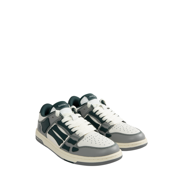 Image 2 of 5 - GREEN - Amiri Varsity Skel Top Low Sneakers are a lace-up style with perforation details, signature graphics, leather appliques, and two-tone rubber soles. Leather uppers. Made in Vietnam.  