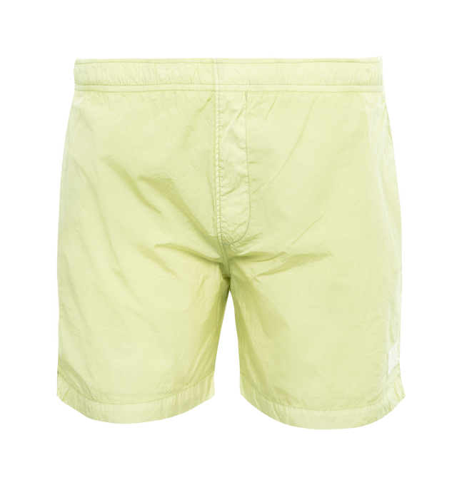 GREEN - C.P. COMPANY Eco-Chrome R Swim Shorts featuring tonal stitching, two side slash pockets, logo patch to the leg, short side slits, thigh-length, mesh lining and elasticated waistband with internal drawstring. 100% polyamide.