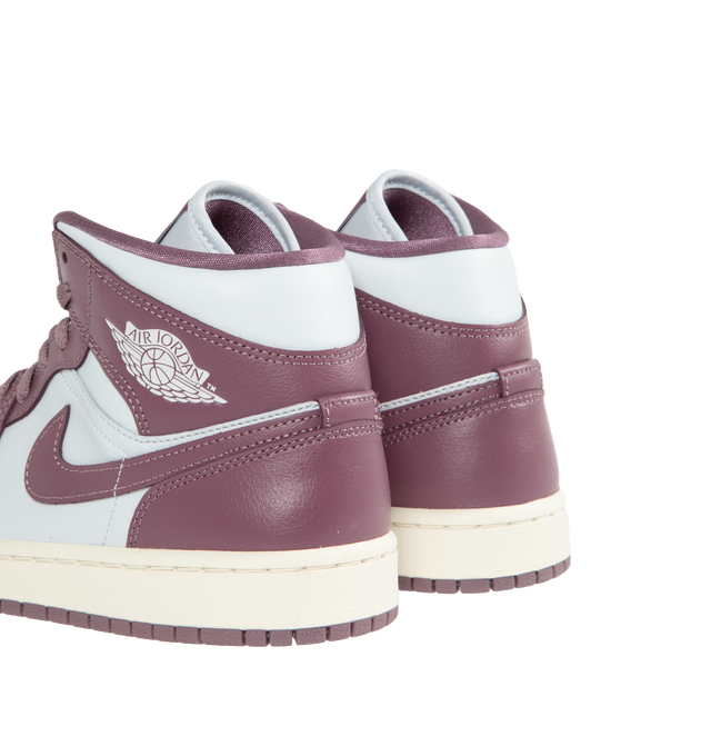 PURPLE - JORDAN Air Jordan 1 Mid featuring premium leather and synthetic upper provides durability, comfort and support. Air-Sole unit in the heel delivers signature cushioning. Rubber outsole offers traction on a variety of surfaces.