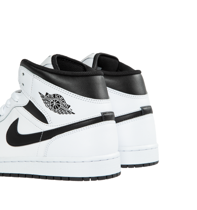 WHITE - AIR JORDAN 1 MID features Leather, synthetic leather and textile upper for a supportive feel, foam midsole and Nike Air cushioning provide lightweight comfort and rubber outsole with pivot circle which gives you durable traction.