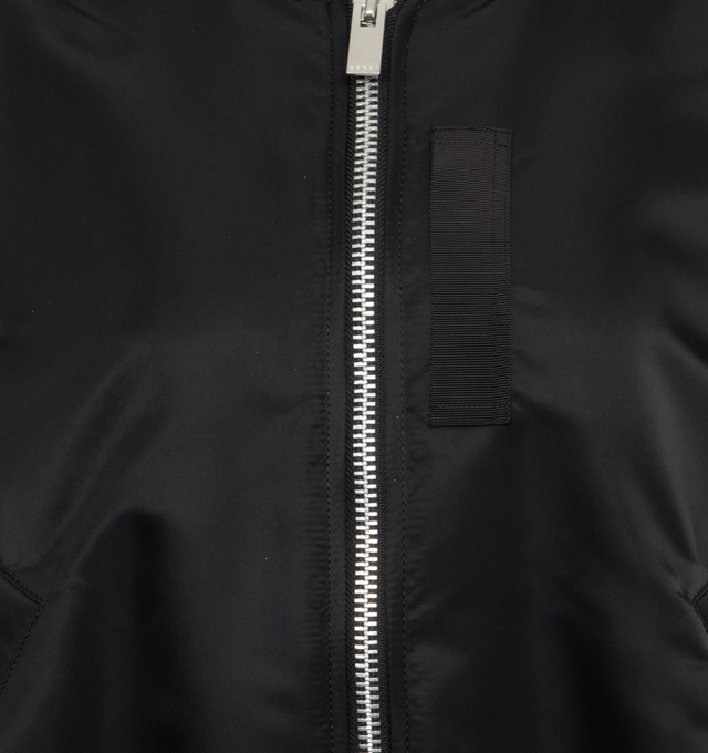 Image 3 of 3 - BLACK - SACAI Nylon Twill Blouson featuring grosgrain-trimmed pleated shell, ribbed collar, hem and cuffs and two-way zip fastening through front. 100% nylon. 