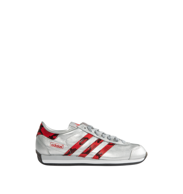 Image 1 of 5 - SILVER - ADIDAS Country Japan Sneakers are a lace-up retro style with metallic leather upper with snakeskin-patterned detail on the heel tab and signature 3-Stripes, EVA midsoles, and rubber outsoles. 