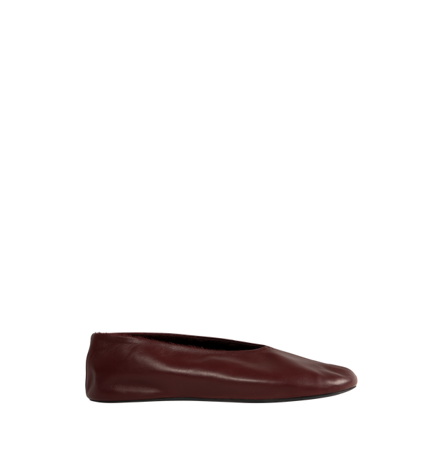 Image 1 of 4 - RED - The Row Women's Stella Slippers are crafted from smooth nappa lambskin leather and feature a slip-on silhouette with an oval toe, soft shearling lining, and a flexible rubber-coated sole. These designer leather slippers combine exceptional Italian craftsmanship with luxurious comfort, making them an elevated choice for effortless everyday wear. Main Material: 100% Lambskin Leather. Lining: Shearling. Sole: Rubber-Coated. Made in Italy. 