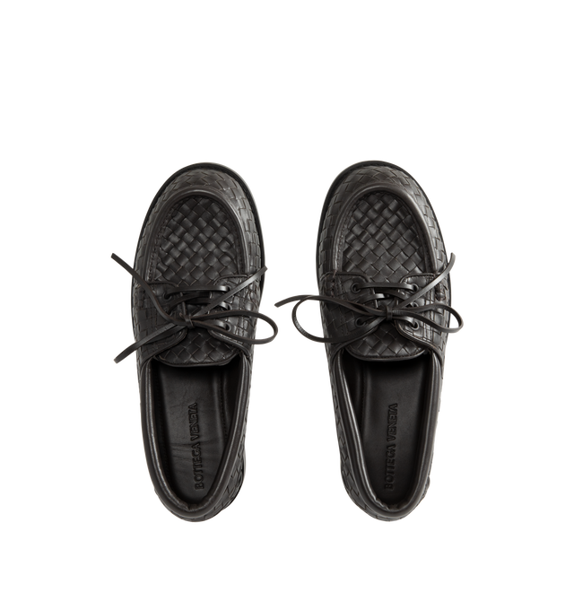 Image 4 of 4 - BROWN - Bottega Veneta Mens Intrecciato Boat Shoes are crafted from Intrecciato calfskin leather. Feature a lace-up boat shoe silhouette, calfskin lining, rubber outsole, and flat heel. Main Material: Calfskin Leather; Lining: Calfskin Leather; Sole: Rubber. Made in Italy. 