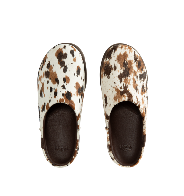 Image 4 of 4 - BROWN - Ugg Women's Otzo Western Clog is crafted with a hand-painted cow hair upper and reimagines the brands signature clog silhouette through a Western-inspired lens. Designed for all-day comfort, this distinctive style features a leather and RWS wool jersey lining enhanced with a peppermint-based anti-odor treatment, along with a contoured EVA footbed for cushioning and support. A leather and microfiber sockliner provides additional comfort, while the lightweight rubber outsole with 30% FC 