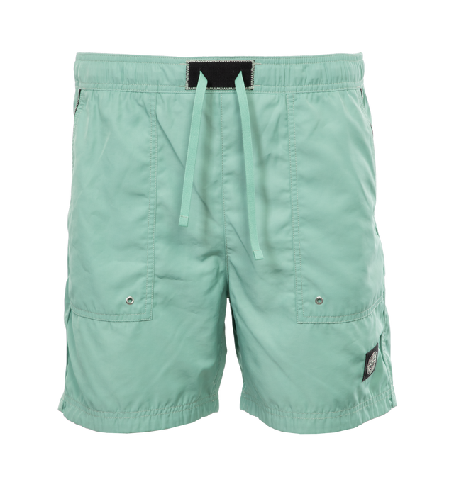 GREEN - STONE ISLAND Swim Trunks featuring regular fit, patch hand pockets with slanting opening edged with inner tape, back patch pocket with fixed flap and hidden zipper closure with nylon trim, Stone Island Compass patch logo on the left leg, inner mesh lining and elasticized waistband with outer drawstring set on tap tab. 100% polyester. Lining: 100% polyamide/nylon.