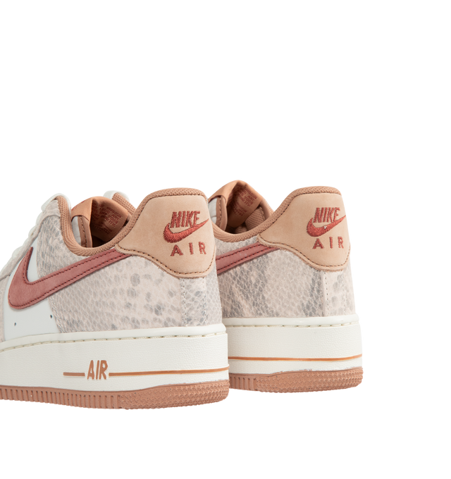 Image 3 of 5 - PINK - NIKE Air Force 1 '07 LV8 Sneaker featuring leather upper with a perforated toe box, Nike Air cushioning, rubber outsole with heritage hoops pivot circles, suede Swoosh logo, padded collar and foam midsole. 