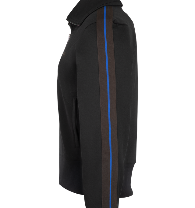 Image 3 of 3 - BLACK - Wales Bonner Men's Form Track Jacket features a streamlined sportswear-inspired silhouette with a piqu texture, front zip fastening, long sleeves, pointed collar, elasticated cuffs, and an elasticated hem. Composition: Outer: Polyester 56%, Cotton 39%, Elastane 5%; Lining: Organic Cotton 100%. Made in Portugal. 