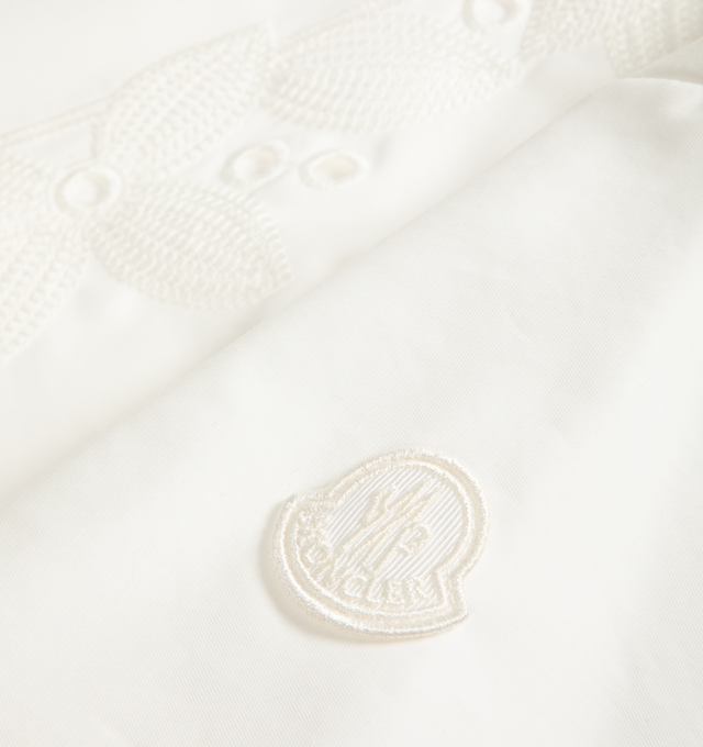 Image 2 of 2 - WHITE - MONCLER Embroidered Shirt Dress featuring a cotton and nylon blend, technical twill at the back, sleeves, collar, and pockets, shirt collar, embroidered detail at the front, front closure with snap buttons, seam pockets and logo patch. 61% cotton, 39% polyamide/nylon. Made in Moldova. 