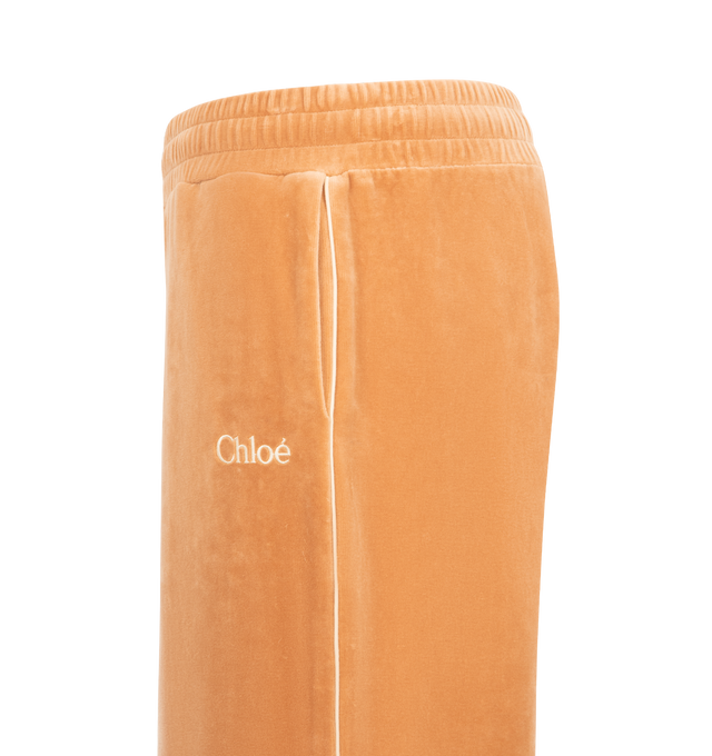 Image 3 of 3 - ORANGE - CHLOE Terry Drawstring Pants featuring relaxed fit, straight-leg, elasticated drawstring waistband, side pockets, full length and piping detail down leg. 80% cotton, 20% polyamide. Made in Portugal. 