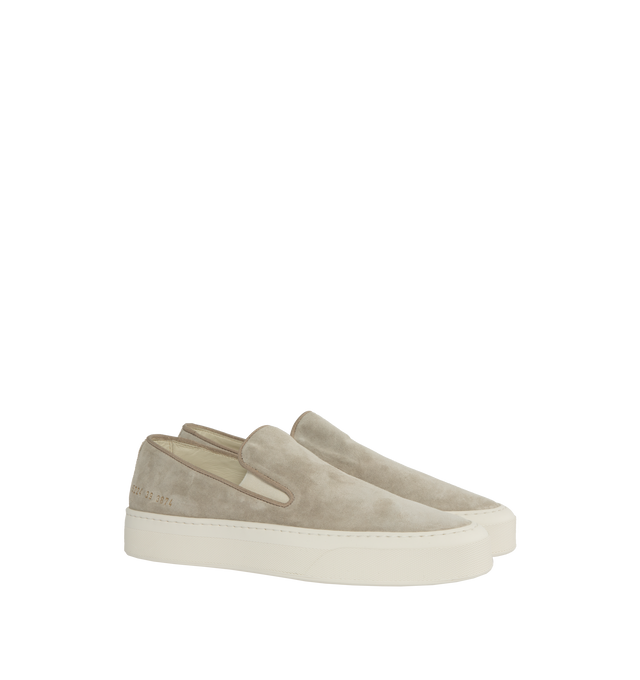 Image 2 of 5 - NEUTRAL - Common Projects minimalist slip-on sneaker crafted from calf suede in a sleek, round-toe profile with thick rubber soles detailed at the heels with signature gold serial number stamp. Made in Italy. 