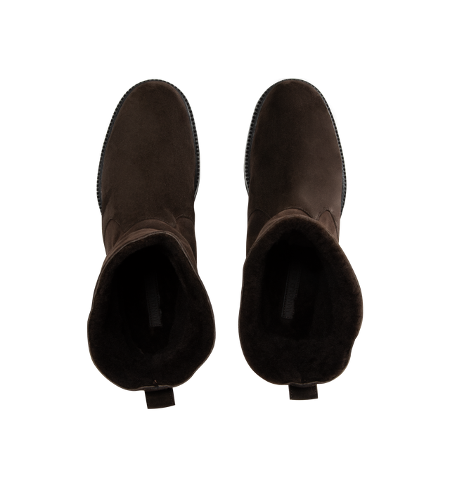 Image 4 of 4 - BROWN - MANOLO BLAHNIK Tomosa Boot featuring suede mid calf boots, shearling lining, pull on design and flat lugged rubber sole. Heel measures 10 mm. Upper: 100% kid suede. Sole: 80% rubber, 20% calf leather. Lining: 100% sheep leather. 