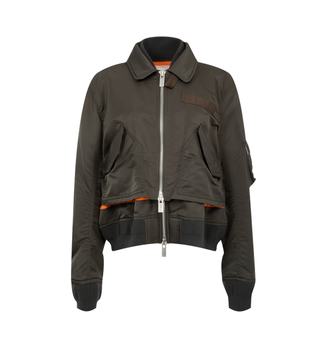 Image 1 of 4 - BROWN - Sacai Nylon Twill Blouson is crafted from nylon twill with lightweight padding. Features a blouson silhouette, mixed-media paneling, full lining, and modern utility-inspired construction. Outer: 100% Nylon; Parts: 55% Polyester, 44% Cotton, 1% Polyurethane; Lining: 100% Polyester; Filling: 100% Polyester. Made in Japan. 