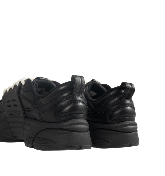 Image 3 of 5 - BLACK - Men's Jordan Trunner O/S SP Sneakers feature a leather upper with synthetic overlays, molded midfoot support wings, and signature Jordan branding for a modern athletic look. These lifestyle sneakers combine responsive Cushlon 3.0 foam cushioning, a lightweight foam midsole, and a durable rubber outsole for exceptional comfort, stability, and everyday traction. Main Material: Leather and Synthetic. Midsole: Foam with Cushlon 3.0 Cushioning. Sole: Rubber. 