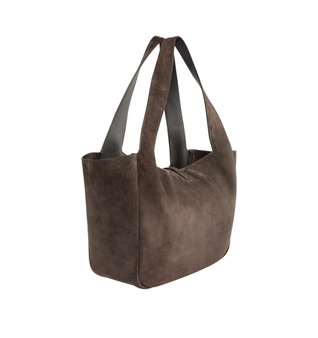 Image 2 of 3 - BROWN - SAINT LAURENT Le 5  7 Bea Suede Bag featuring supple tote in suede, lightweight and fully lined in tonal suede, inner zip pocket, leather tab closure decorated with the cassandre, east/west format and inner ties allow the sides to be collapsed or expanded to create different silhouettes. 19.7" x 11" x 7.1". Calfskin. Made in Italy. 