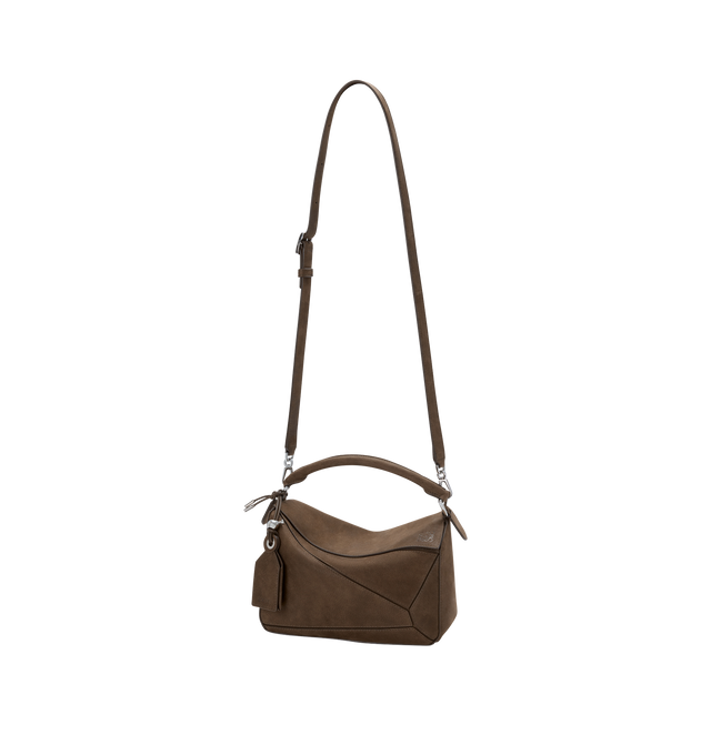 Image 3 of 5 - BROWN - LOEWE Small Featherlight Puzzle bag in grained nubuck featuring distinctive geometric lines and cuboid form, shoulder, crossbody or hand carry, detachable and adjustable strap with rotating dogclips, zip closure with articulated pull, one external zipped rear pocket, one internal slip pocket, detachable LOEWE embossed tag with secret pocket and balloon dice, baguette-shaped metal feet, nappa lambskin lining and embossed Anagram, LOEWE engraved internal plaque. Grained nubuck. 16.5 cm  
