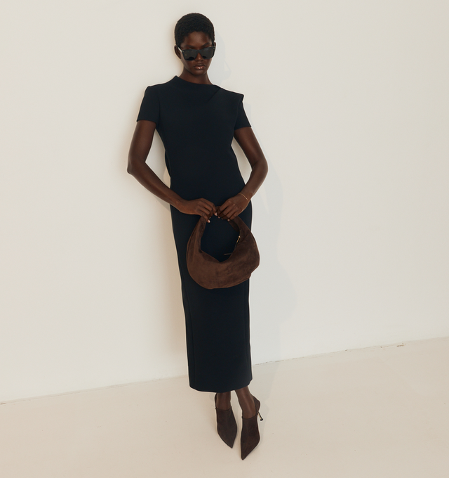 Image 2 of 5 - BLACK - KHAITE Iryl Dress featuring a fluid, open-back dress, architectural structure, softly contoured side panels, a back slit, concealed zipper closure and lined in soft silk habotai. 100% polyester. 