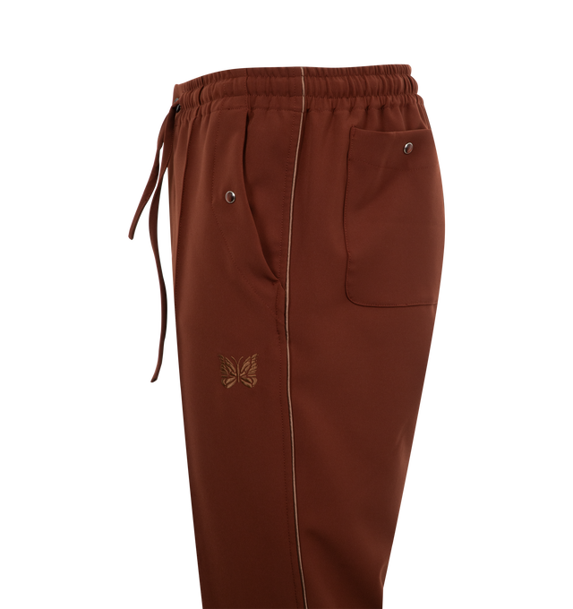 Image 3 of 3 - BROWN - NEEDLES Piping Cowboy Trousers featuring stretch polyester, drawstring at elasticized waistband, four-pocket styling, zip-fly, logo graphic embroidered at front, pinched seam at front legs and satin piping at outseams. 89% polyester, 11% polyurethane. Trim 1: 100% polyester. Trim 2: 100% rayon.  