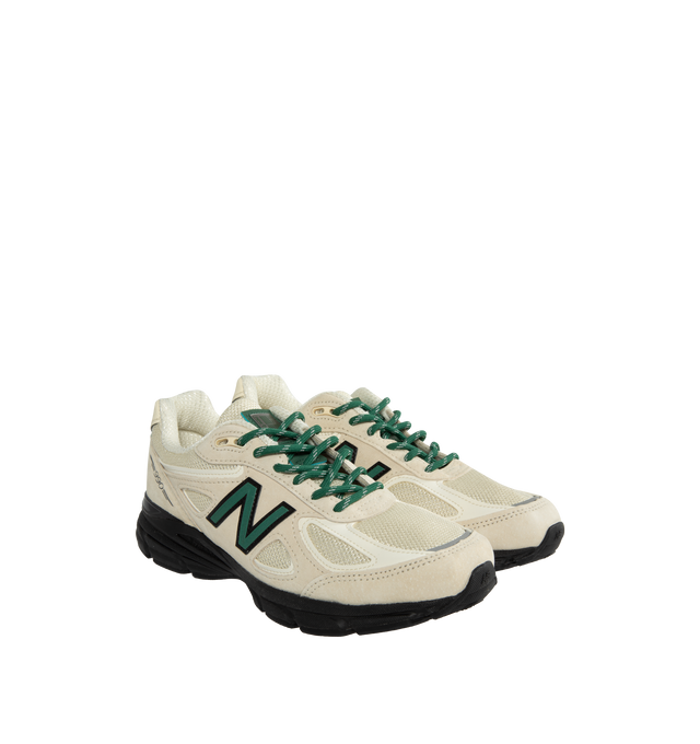 Image 2 of 5 - WHITE - NEW BALANCE 990 sneaker in "Macadamia Nut" colorway crafted from premium materials, light beige mesh uppers, cream suede, accented with pops of green and black throughout. The signature 990 branding marks the heels and sidewalls, while the iconic ENCAP midsole and foam cushioning provide unparalleled comfort underfoot. Featuring mesh uppers, suede overlays, rubber outsole. Made in the USA. 