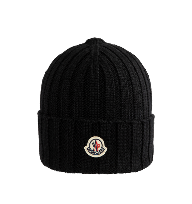 Image 1 of 2 - BLACK - Moncler Wool Beanie features a rib-knitting and logo at front. Designed to provide warmth, this heavy knit beanie for women adds the finishing touch to cold-weather looks. 100% virgin wool . 