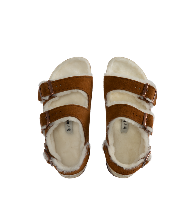 Image 4 of 4 - BROWN - BIRKENSTOCK Milano Shearling Suede Sandal featuring logo-engraved buckle, double-strap design, round open toe, buckle fastening front straps and slingback strap, shearling lining, moulded footbed and flat sole. Dyed real sheep fur. EVA sole. 