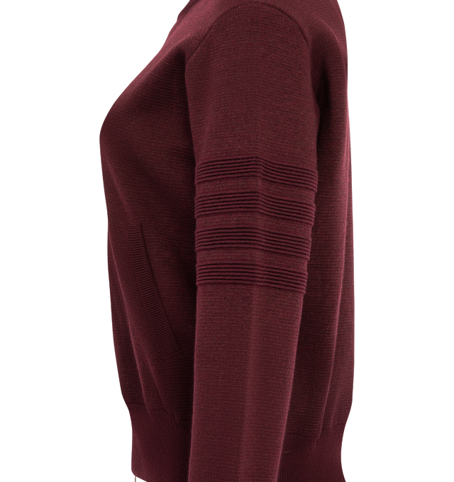 Image 3 of 3 - RED - Thom Browne Women's Ottoman Milano Stitch 4-Bar Bomber Jacket is crafted from wool and features the brands signature 4-bar detailing rendered in a raised ottoman-stitch construction along the sleeve. Designed with a refined bomber silhouette, the jacket is finished with a two-way zip closure, rib-knit bomber collar, cuffs, and hem, and welt hand pockets with rib-knit trim. Thom Brownes signature striped grosgrain loop tab completes the design. Main Material: Wool. Made in Italy. 