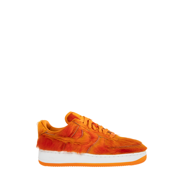 Image 1 of 5 - ORANGE - Nike Air Force 1 "Multi-Color and Sunset" Sneakers update the classic basketball-inspired silhouette with a shaggy, hair-like upper in vivid sunset orange. Tonal Swoosh branding, a lace-up closure, and a padded collar complete the low-top design, while a white Air-cushioned midsole and orange rubber outsole provide comfort and traction. Sole: Rubber. 