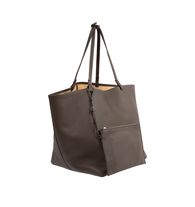 Image 4 of 5 - BROWN - THE ROW XL Park Tote Bag in Leather featuring classic tote bag in textured calfskin leather with interior tie closure, flat handles, and removable interior wristlet with adjustable strap. 100% calfskin leather. Lined in 100% calfskin leather. Made in Italy. 