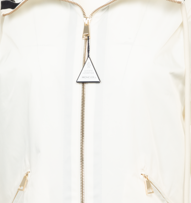 Image 3 of 3 - WHITE - MONCLER Cassiopea Jacket featuring grosgrain details on the hood, front, hem and sleeves, hood, zipper closure, zipped pockets and hem with drawstring fastening. 100% polyester. Made in Romania 
