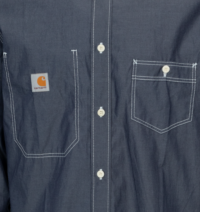 Image 3 of 3 - BLUE - JUNYA WATANABE x CARHARTT Chambray Shirt featuring patch pockets on the chest, button down fastenings, button down collar and contrasting stitching. 100% cotton. 
