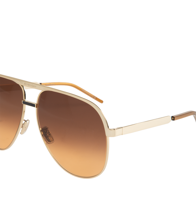 Image 3 of 3 - GOLD - GIVENCHY Aviator Metal Sunglasses featuring solid lenses, adjustable nose pads, logo engraved brow bar and thin, tapered arms. Metal. 100% UVA/UVB protection. Made in Italy. 